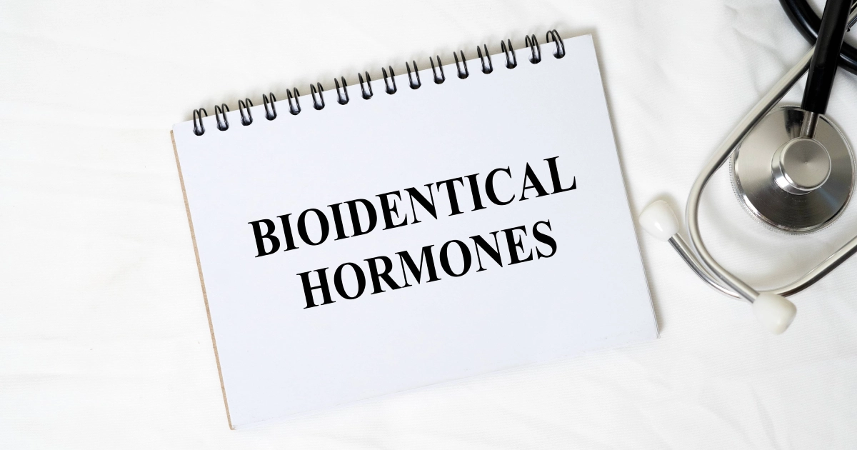 A notepad in St. Peters, MO, beside a stethoscope reads BIOIDENTICAL HORMONES.
