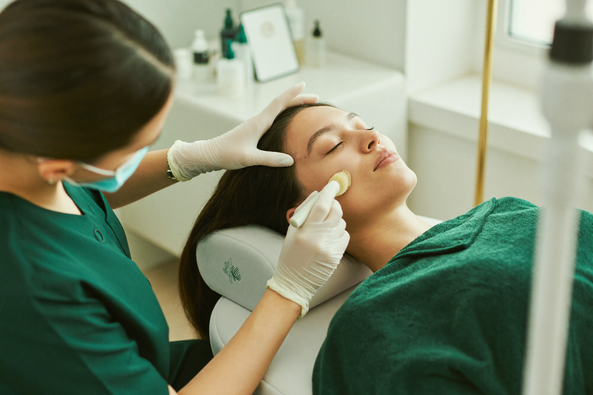Esthetician applying a chemical peel at The Whole You Wellness Center in St. Peters, MO