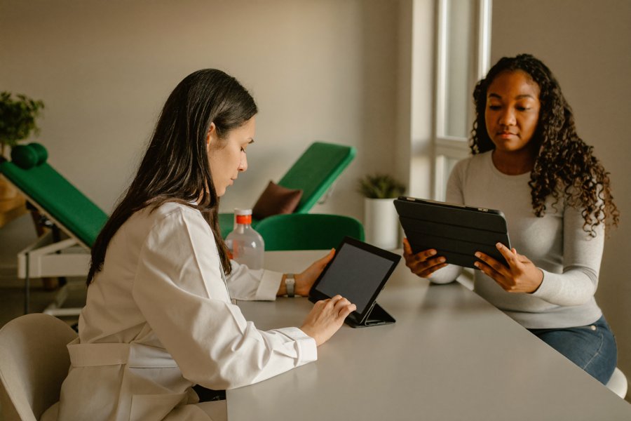 Provider reviewing a personalized Lipodissolve treatment plan with a patient at The Whole You Wellness Center